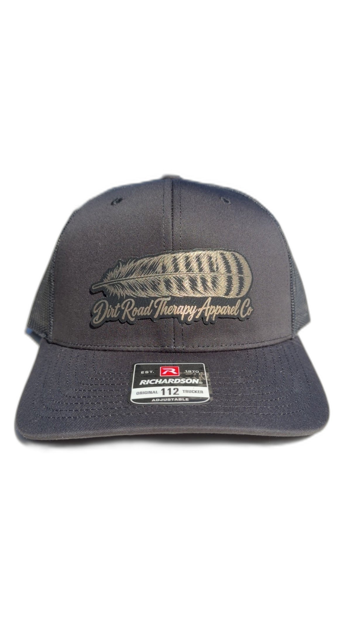 Black Richardson 112 trucker hat with gold leather feather patch, front view