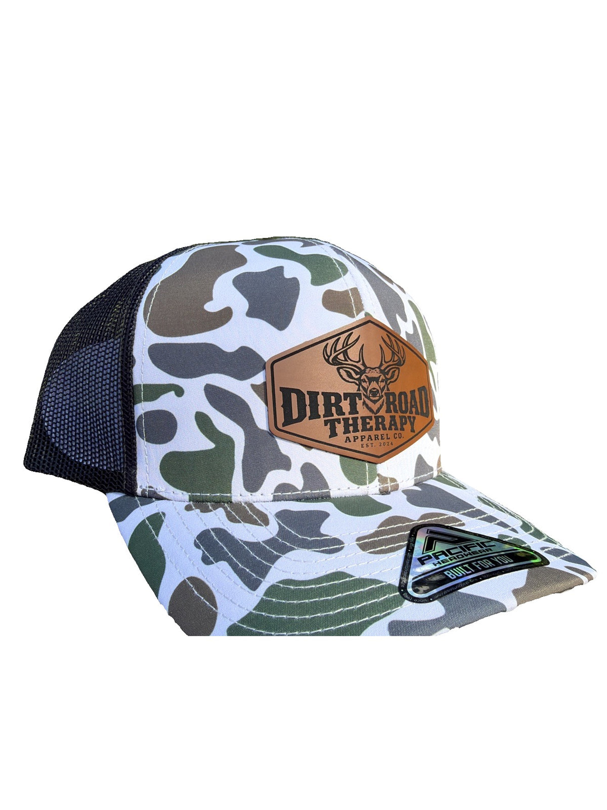 White duck camo trucker hat with leather buck patch, three-quarter view from the right