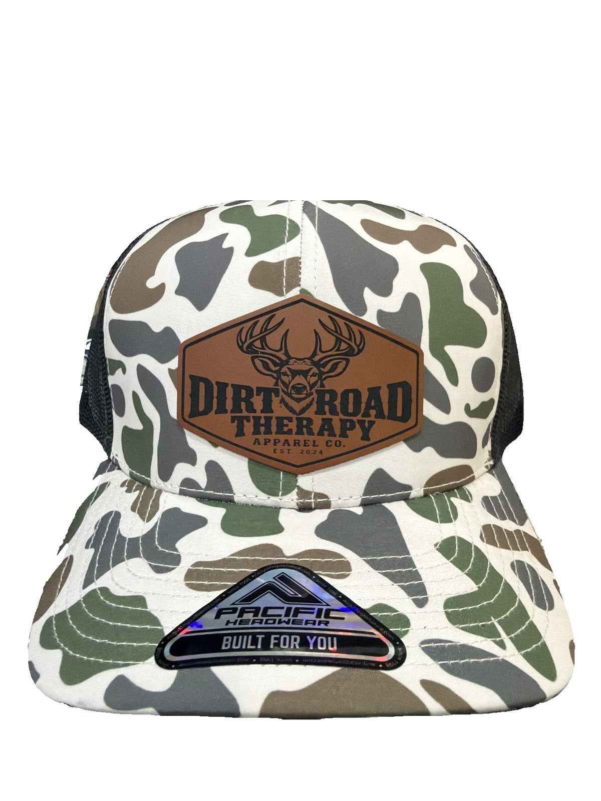 White duck camo Pacific Headwear trucker hat with rawhide leather buck patch, front view