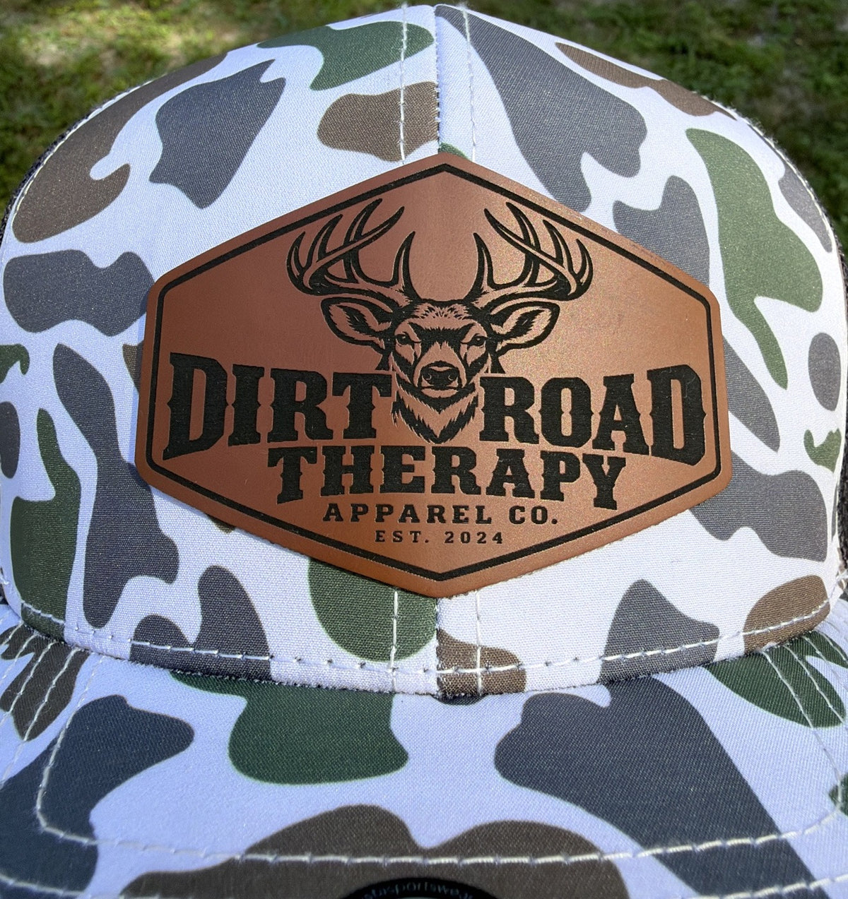 Laser-engraved rawhide leather buck patch, close-up